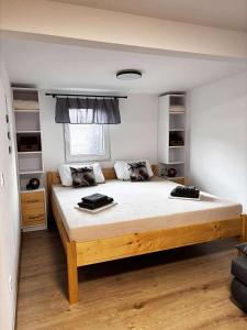 a bedroom with a large bed in a room at Moon apartments in Pakoštane