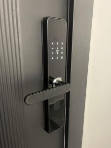 a metal door with a handle on a refrigerator at E - Central Room Two in Skopje