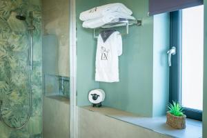 a bathroom with a shower and a white towel at Bennachie Lodge in Huntly