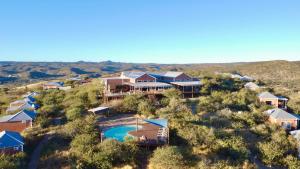 an aerial view of a resort with a pool at River Crossing Lodge in Windhoek