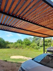 a roof of a car under a metal roof at Casita Rosa II in San José