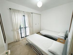 a hospital room with two beds and a window at Sunset View in Polis Chrysochous +31 photos