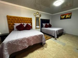 a bedroom with two beds at Tana B Guesthouse in Welkom