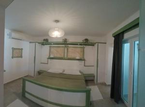 a bedroom with two beds and a window and a light at Guest House Green Corner Supetarska Draga in Supetarska Draga +53 photos