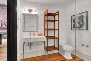 a bathroom with a sink and a toilet at Luxe 220 Suite 2 in Wilmington +66 photos