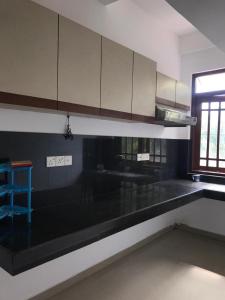 a kitchen with a black counter top and a sink at Slayan properties in Gampaha