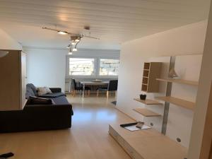 a living room with a couch and a table at Ferienhof Raither in Immenstaad am Bodensee