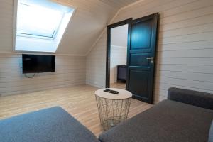 a room with a bed and a window and a door at Bakkebyvegen 22A in Trysil