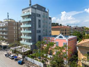 an aerial view of a tall building in a city at Amadei Hotel Blumen in Pesaro