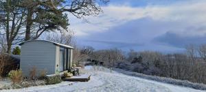 a small shed on a snow covered road at Shepherds Hut in Staithes