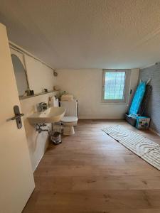 a bathroom with a sink and a toilet at 115 qm Apartment für bis zu 8 Personen mit 4 Schlafzimmern in Lünen