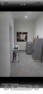 an empty room with a table in a room at Mya Apartment in Madina +23 photos