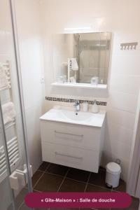 a white bathroom with a sink and a mirror at Le Chant des Sources, Gîtes et Chambres d'hôtes avec Vue, à Gimel-les-Cascades in Gimel +58 photos