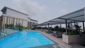 a large swimming pool on top of a building at The Loxwood House Studio in East Legon