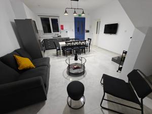 a living room with a couch and chairs and a table at Warda Cottage in Central Rabat in Rabat