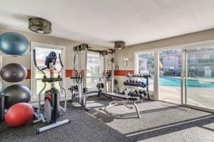 a fitness room with a gym with a swimming pool at Pleasanton Gem in Quiet Community w/ Pool Access in Pleasanton