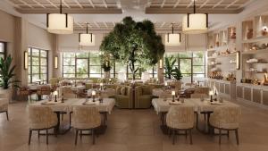 a restaurant with tables and chairs in a room at The Bristol Bol - NEW IN 2026 in Bol