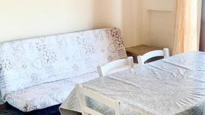 a bedroom with a bed and chairs and a mattress at RM05 - Senigallia, trilocale fronte mare in Senigallia +4 photos