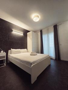 a bedroom with a large bed and a window at Cozy Room G10 in Valencia