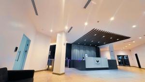 a lobby with a black and white wall at The Loxwood House Studio in East Legon +16 photos