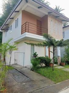 a house with a balcony on top of it at CasaMia in San Pablo