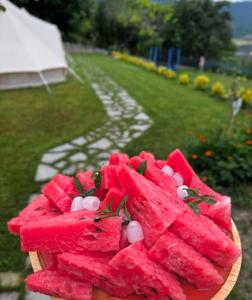 a plate of watermelon with candy on top of it at Sunny Village Hotel in Haghpat +41 photos