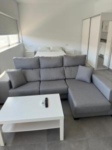 a living room with a couch and a table at El Merendero in Utrera