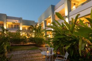 a courtyard of a building with a table and chairs at Blue Haven Holiday Apartments in Christ Church