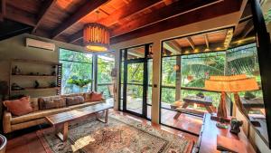 a living room with a couch and a table at RiverHill Hideaway in Monkey Fall