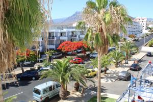 an aerial view of a parking lot with palm trees at FN Funchal Tenerife in Los Cristianos +45 photos