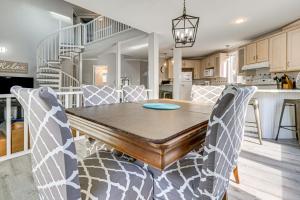 a kitchen and dining room with a table and chairs at Riverfront Savannah Getaway w/ Pool & Dock! in Savannah
