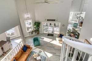a living room with a couch and a table at Riverfront Savannah Getaway w/ Pool & Dock! in Savannah