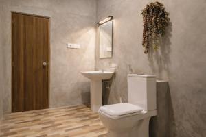 a bathroom with a toilet and a sink at Wild Pulse Yala in Tissamaharama