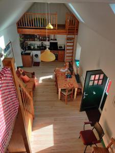 an overhead view of a living room with a table and a kitchen at Carrowkeel Cottage in Athlone