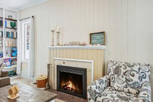 a living room with a couch and a fireplace at A Shore Thing in Douglas
