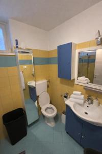 a bathroom with a toilet and a sink at Urban Nest Nova Gorica in Nova Gorica