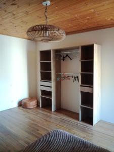 a room with shelves and a ceiling at Maison à Briançon in Briançon +5 photos