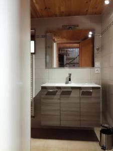 a kitchen with a sink and a counter at Maison à Briançon in Briançon