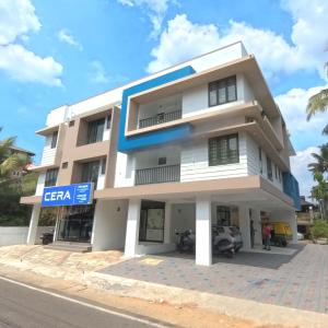 a building on the side of a street at Philip's Signature Suites in Cochin