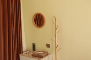 a corner of a room with a table and a mirror at Diiza Glamping Tawangmangu Private Pool No BBQ in Tawangmangu +7 photos