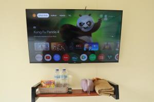 a picture of a monkey hanging on a wall at Diiza Glamping Tawangmangu Private Pool No BBQ in Tawangmangu