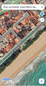 a map of a beach with a road and the ocean at Pousada Pérola dos Corais Maceió in Maceió