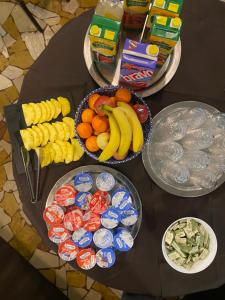 a table topped with plates of food and drinks at Hotel New Primula in Rimini