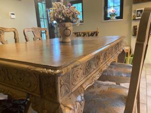 a dining room table with a vase on top of it at Villa Aurelia Old Town in Kavála