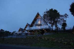 a house with a glass roof on top of a hill at Winter Whisper in Jāmb