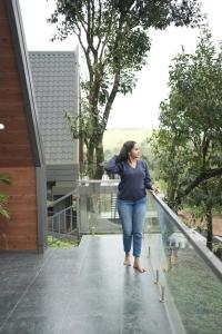 a woman walking on a walkway outside a house at Winter Whisper in Jāmb