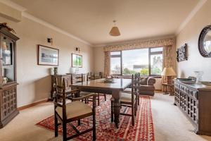 a dining room with a table and chairs at Melon Park - Elie in Elie