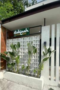 a building with a sign on the side of it at Sakinah Rumah Kost in Sanggung