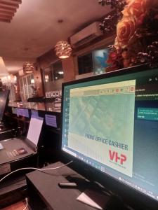a computer monitor sitting on top of a desk at Sakinah Rumah Kost in Sanggung