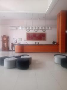 a living room with a table and some chairs at Sakinah Rumah Kost in Sanggung